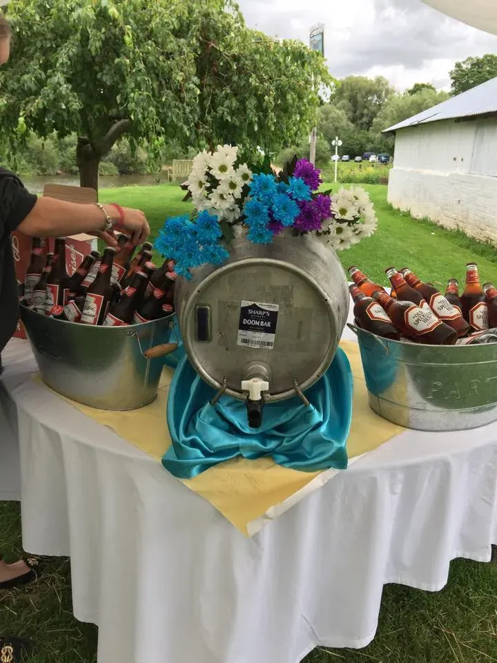 Bottled drinks chilled in a rustic metal tub