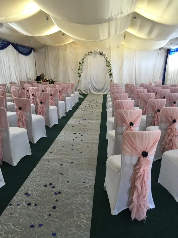 The hall dressed in blush pink for a ceremony