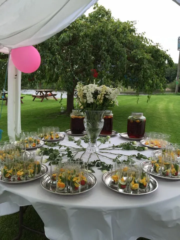 Outdoor tables set across the venue lawn